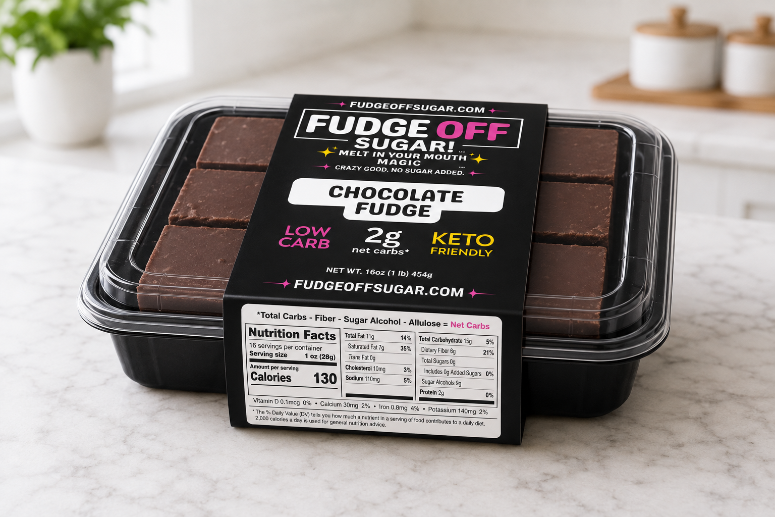 A package of Fudge Off Chocolate Fudge by FudgeOffSugar.com, shown in a clear plastic clamshell container with a black label, placed on a light marble countertop with blurred kitchen items in the background.